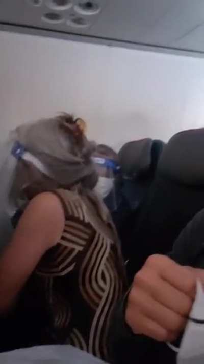 Man eats snickers bar next to two old people