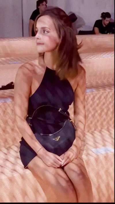 Emma Watson looks almost arrogant while she teases everyone with her legs