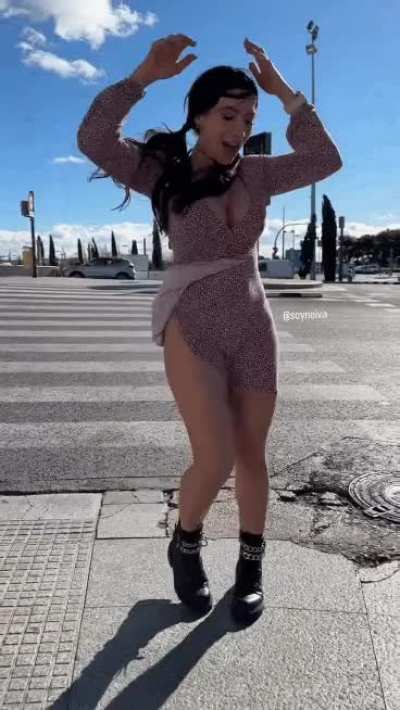 The wind almost took her dress away