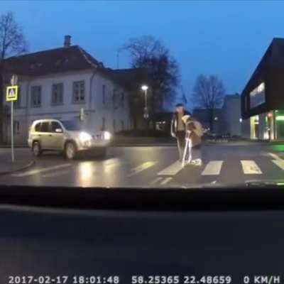 Good guy helping the old lady crossing the road