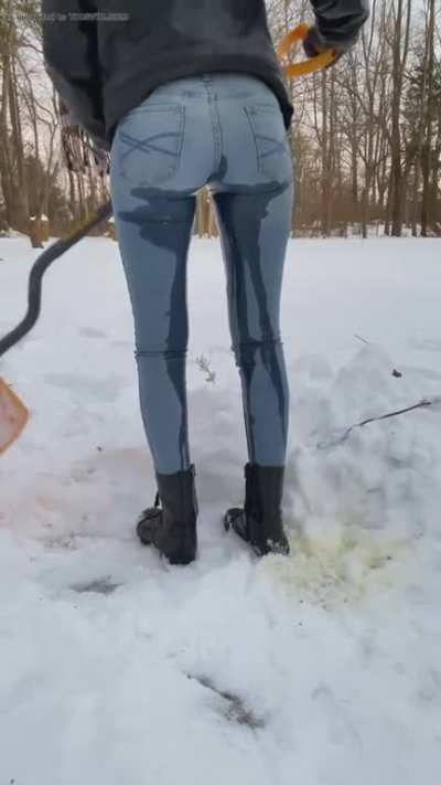 Girl pees her jeans in the snow