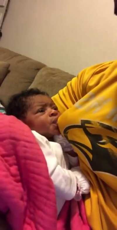 The mom isn't home and the baby wouldn’t take the bottle, so he had to improvise.