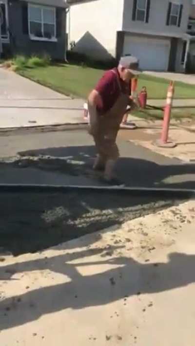 Old man freaks out over a truck parked outside his house, hits concrete company truck with a hammer then falls into wet concrete.