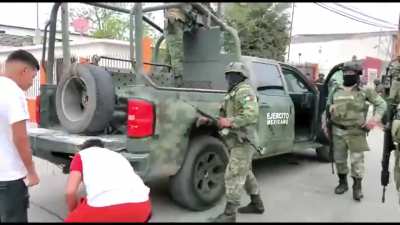 After a gunfight between soldiers and cartel gunmen civilians that support the local cartel come out and harass the troops. Forcing one of the soldiers to use his pistol in Nuevo Laredo, Mexico