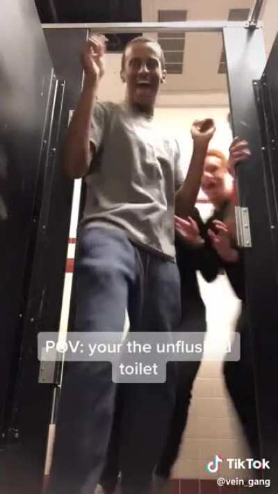 he is picking up the entire toilet and putting it in his mouth