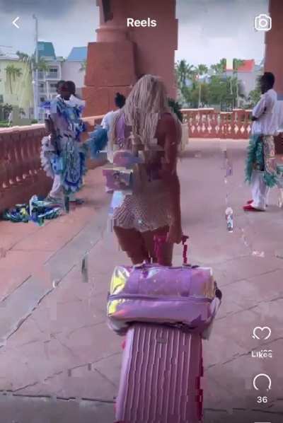 No one shook their head "no" when she sat on the luggage cart