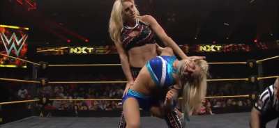 Charlotte exposing Alexa&rsquo;s stomach with an abdominal stretch