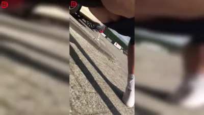 Dude takes a seat on towbar naked.