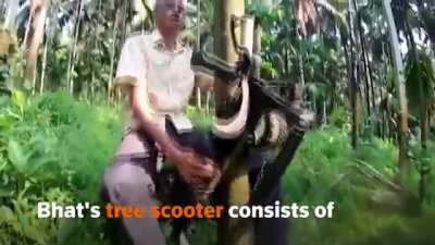 Indian farmer repurposed a scooter to climb up tall trees.