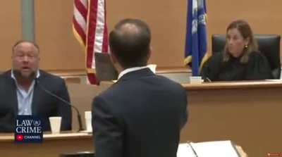 Alex Jones has been broadcasting his show during his defamation trial. He's been calling the judge a "tyrant" while showing graphics of her with lasers coming out of her eyes.