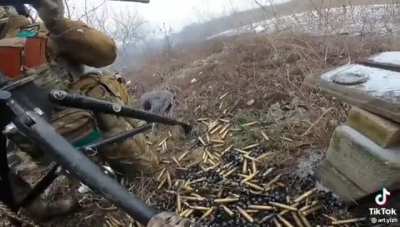 Ukrainian weapons crew with a tripod-mounted M2 giving the whole nine yards