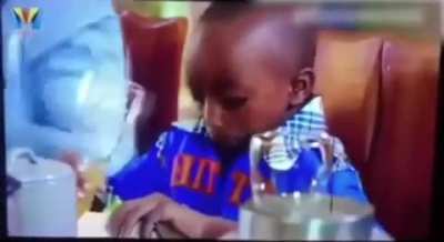 Kid forgets how to drink out of a cup