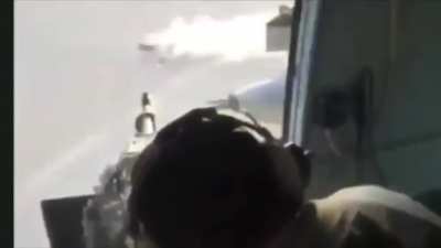 An Iraqi Mi-17 door gunner strafes a fleeing ISIS car with Heavy Machine gun fire in Al-Nukhib Iraq. (Mid 2010s)