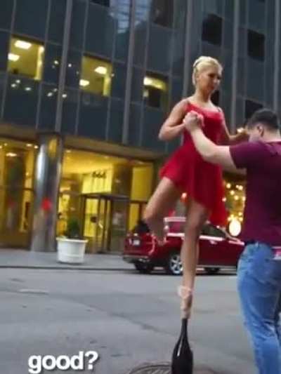 Ballerina balancing on a champagne bottle!