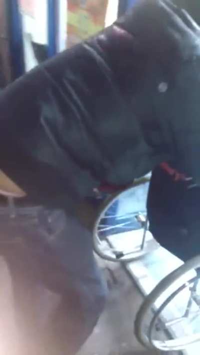 Guy in wheelchair trying to enter store