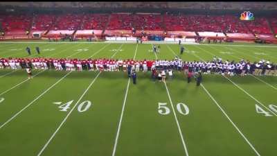 The Chiefs and Texans, arm-in-arm in a show of unity, receive boos from the Kansas City crowd