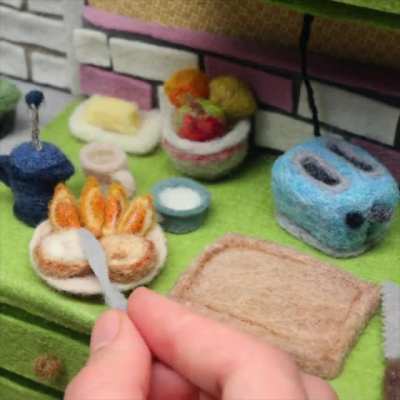 "Bagel Breakfast" by fiber artist Andrea Love. She used stop motion to create this video.