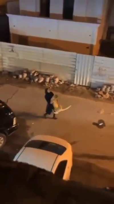 Woman has some trouble carrying her pet cat