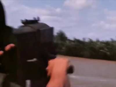 Honeywell Mark 18 hand-cranked 40mm Grenade Launcher in action on a PBR in Vietnam in March 1969