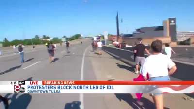 Truck and trailer driver escapes ambush by angry crowd