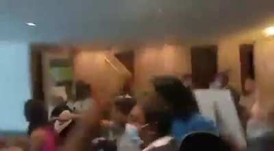 Staff at a Indian sports channel celebrate India's javelin gold