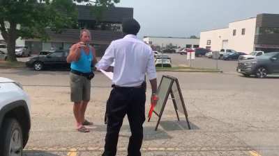 Anti-vax protestor hurling racial abuse at a police officer in Canada today.