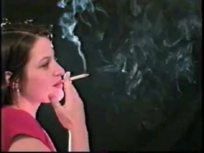 A group of smoking women with some talking exhales