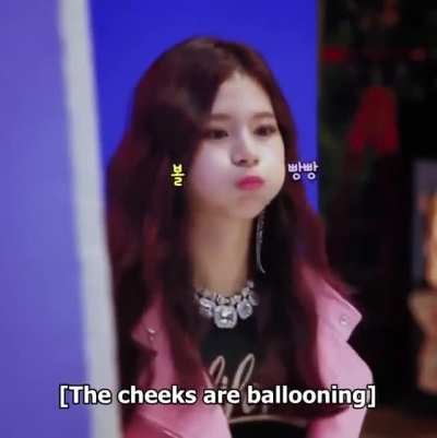 Sana - puffed cheeks, pink jacket, black top