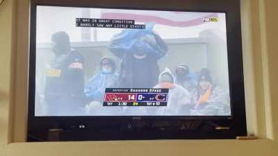 Bears fan struggling to put poncho on in wet &amp;amp; blustery conditions!