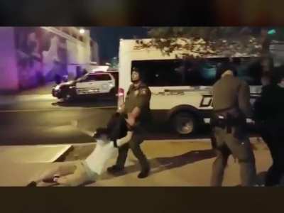 Protester walking to his car gets grabbed and dragged away by police unprovoked.
