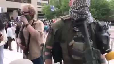An interview with an armed protester in Minnesota. He states that a group has formed.