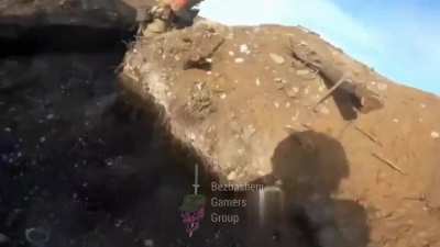 Russian soldiers are trying to storm Ukrainian trenches while being observed and targeted by drones.