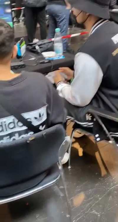 He is playing with a N64 Controller at a Smash Tournament