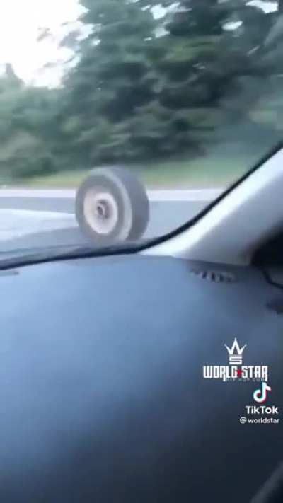 Loose tire does a quick show and then makes some serious damage on the freeway