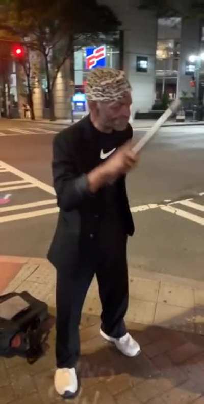Street magician wants you to watch his wand.