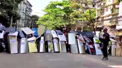 Myanmar Protesters Practice Shield Formation.