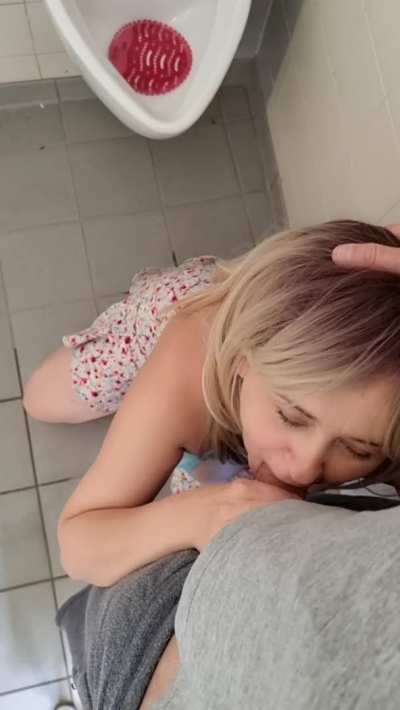 Fucking girlfriend's throat at the urinals