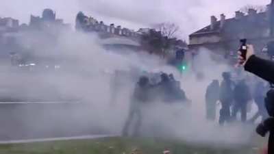 Rookie cop makes a noob move and drops tear gas inside riot line