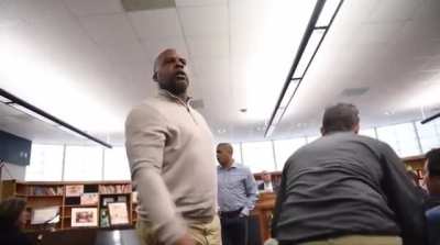 People try to shut down a dad in the crowd for a racist comment.
