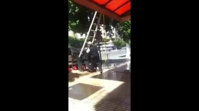 Balancing a ladder on a stack of chairs