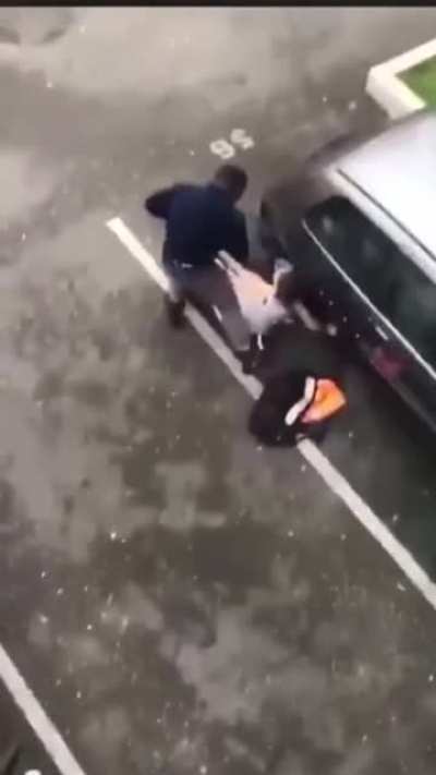 Angry woman attacks car, gets taken out by a dude