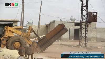 FSA converted a front-end loader into a six barreled "Hell Cannon" which is used against IS positions North of Aleppo - January 2016