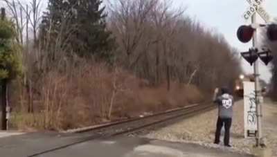 Waving at a train as it goes by... what could go wrong?