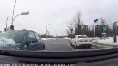 Driving around with a windshield covered in snow