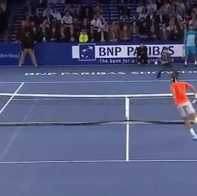 Young boy from the crowd plays against Federer... And the crowd goes pretty wild.