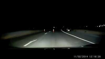 Driver encounters a suspicious roadblock late at night and recognizes it as a trap