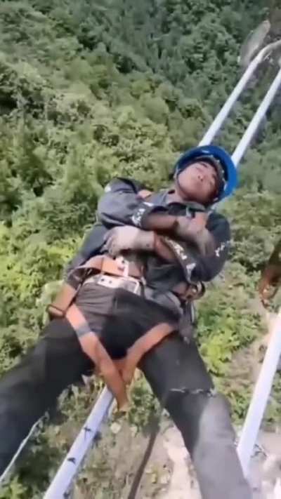 Power line workers in China taking a break in between busy operation shifts.
