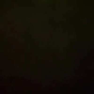 UFO (most likely military? not alien) flies overhead, green beam scanning ground below it...what tech is this? Assuming it's a commonly deployed scanning technique, just happens to look sci-fi