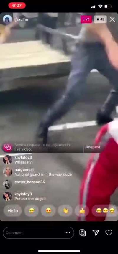 Crazy old man attacks protesters with bow &amp;amp; arrow; his car pays the price.