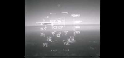 Fighter jet almost collides with an airliner.